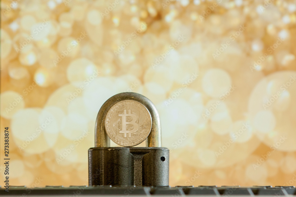 Bitcoin currency on keyboard computer on bokee background.Virtual cryptocurrency concept. Bitcoin currency on keyboard computer on bokee background.Virtual cryptocurrency concept.