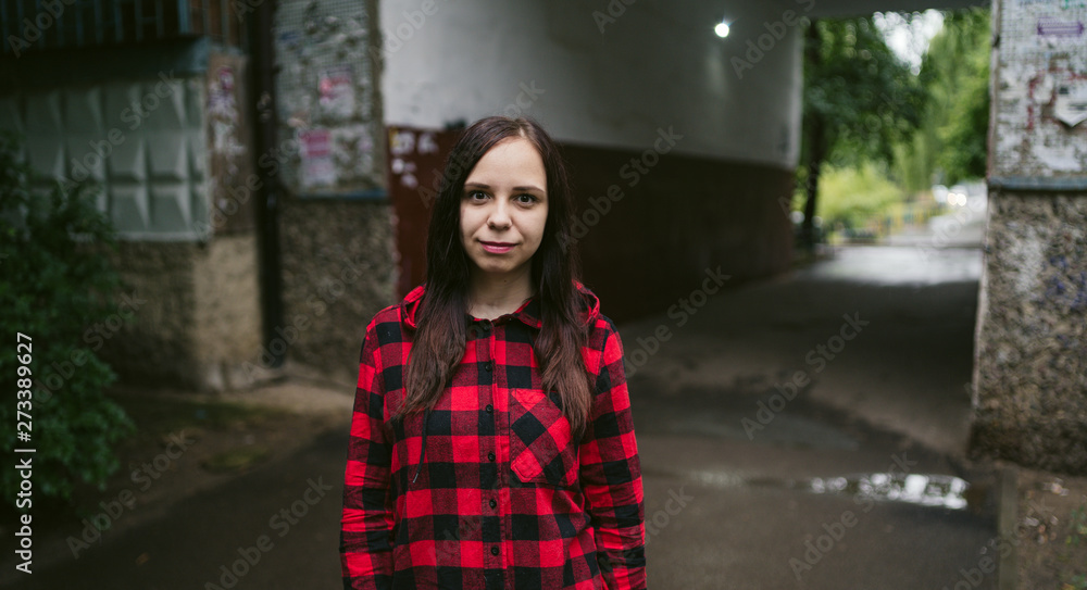 Young woman in casual clothes on the street.
