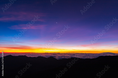 Beautiful and breathtaking sunrise at summit of Haleakala Crater in the National Park on the Hawaiian island of Maui, USA