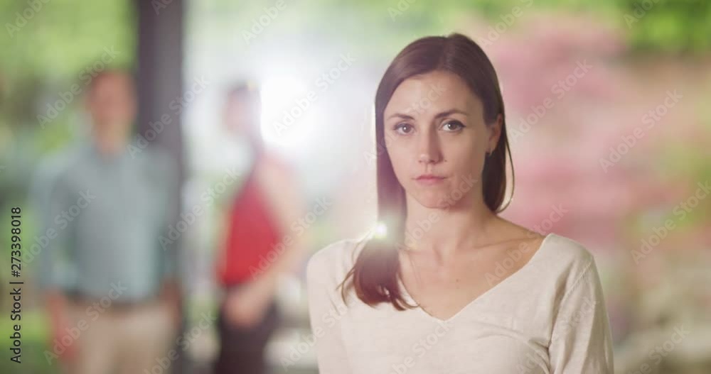 4K Beautiful girl with serious expression looking directly at camera. Slow motion. 4K Beautiful girl with serious expression looking directly at camera. Slow motion.