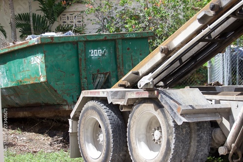 residential  construction site debris collected in roll-off dumpster for efficient disposal