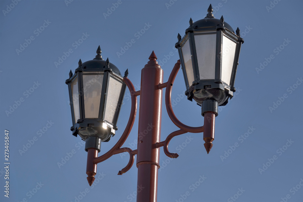 street lamp against the blue sky
