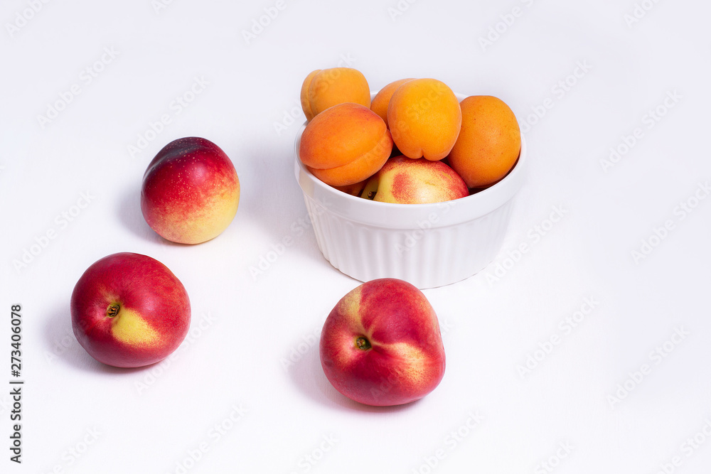 Group of whole nectarine and apricots fruit isolated on white background Group of whole nectarine and apricots fruit isolated on white background