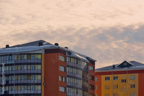 residential buildings at sunset sky background