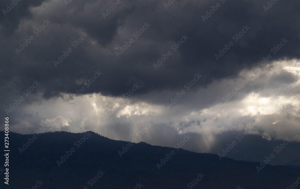 The Dark gray dramatic sky with large clouds on mountain in rainy seasons. The Dark gray dramatic sky with large clouds on mountain in rainy seasons.