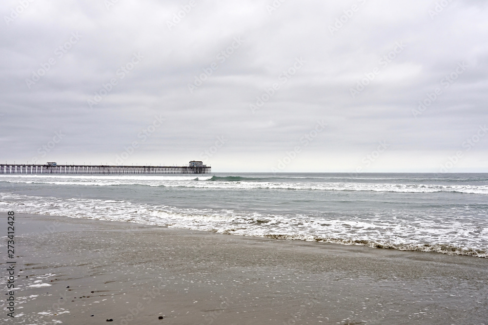 OCEANSIDE, CALIFORNIA - 2 JUNE 2019: Oceanside sea view and pier bridge playground and surfboard  