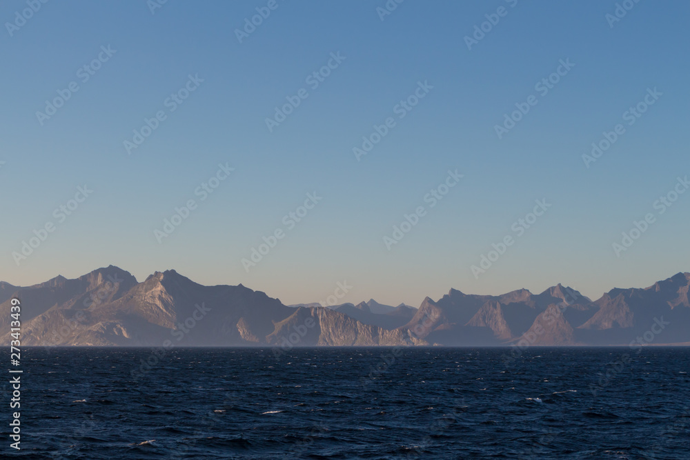 Norwegian fjords with rocky horizon at sunrise