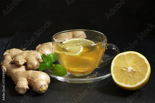 Ginger tea with lemon in glass cup