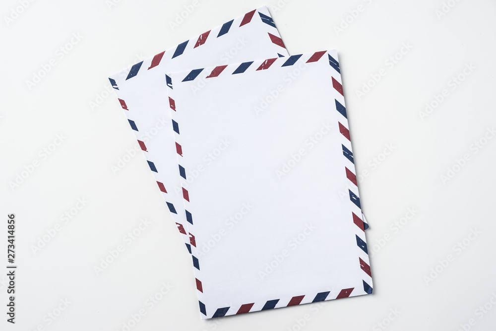 Fototapeta premium Top view of post envelope on white background