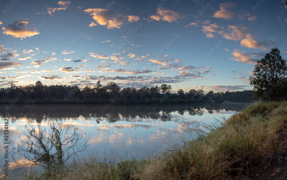 Fototapeta premium River sunrise with reflections and colourful sky