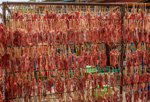 Wallpaper Mural Beef Jerky Strips Hang On a Rack in the Sun Drying. Torontodigital.ca
