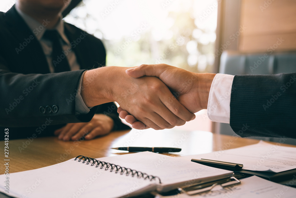 Department heads manager are shaking hands and accept to new employee in office room. Department heads manager are shaking hands and accept to new employee in office room.