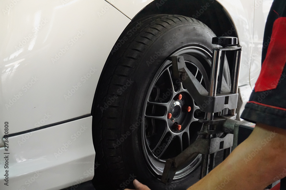 man spooring and balancing your tires on car repairs man spooring and balancing your tires on car repairs