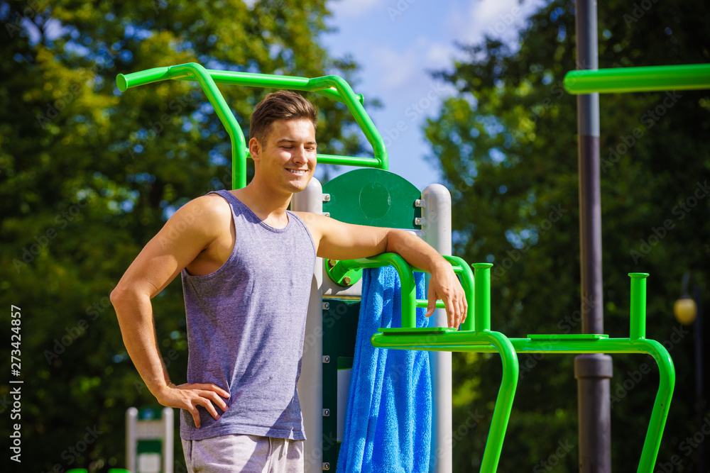 Fototapeta premium Man working out in outdoor gym