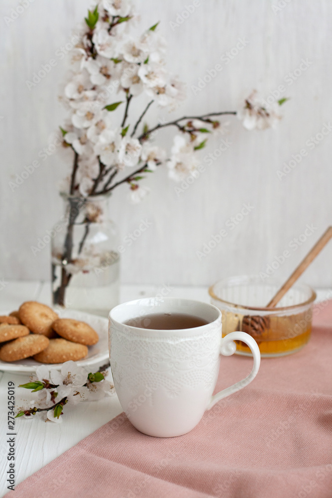 A tasty break: a cup of tea and a plate of cookies. A tasty break: a cup of tea and a plate of cookies.