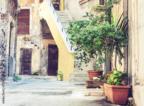 Staircase and plants in tubs in the courtyard of the house in Catania  Sicily  Italy.