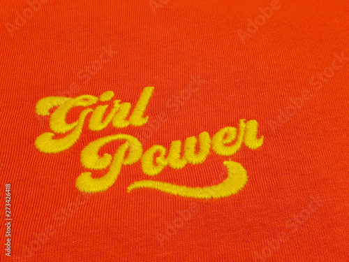 Yellow text girl power quote on vintage red cotton fabric