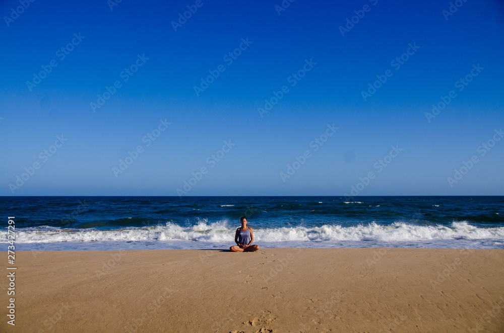 yoga girl on the beach