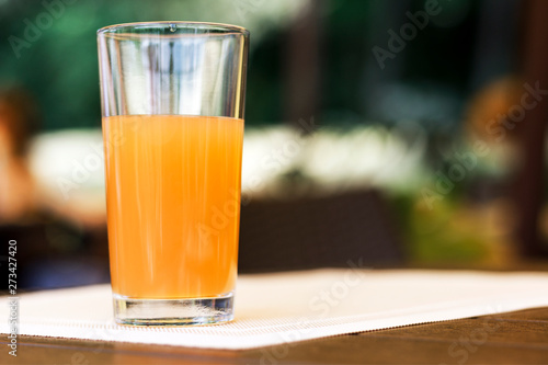 glass of fresh juice on a table in a cafe