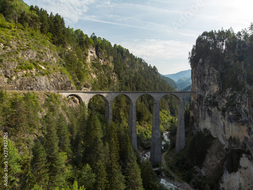 Landwasser Viaduct / Switzerland - August 2018 - The Landwasser Viaduct is used by glacier express trains and popular place of taking photo by tourists. Aerial view