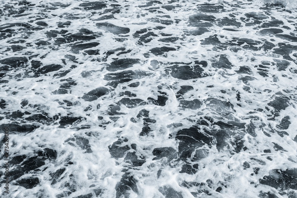 Dark water of stormy sea and white foam. Horizontal color photography. Dark water of stormy sea and white foam. Horizontal color photography.