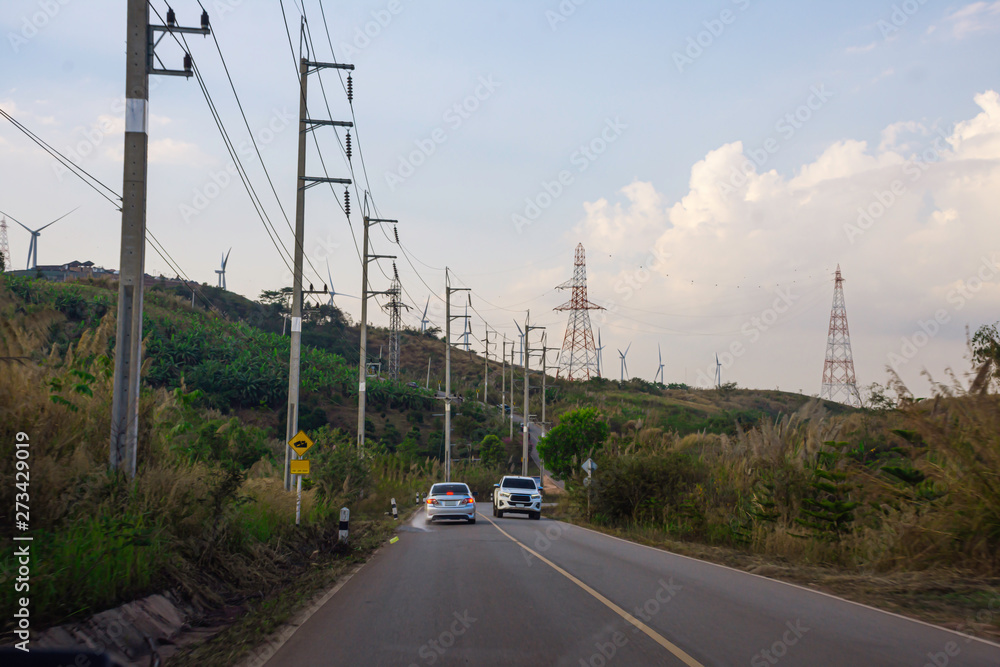 Driving on the road on top of mountain, Landscape nature view on the peak of hills, Roadside view in evening time, Phu Tab Berk mountain in Thailand, Travelling by car with sunset sky