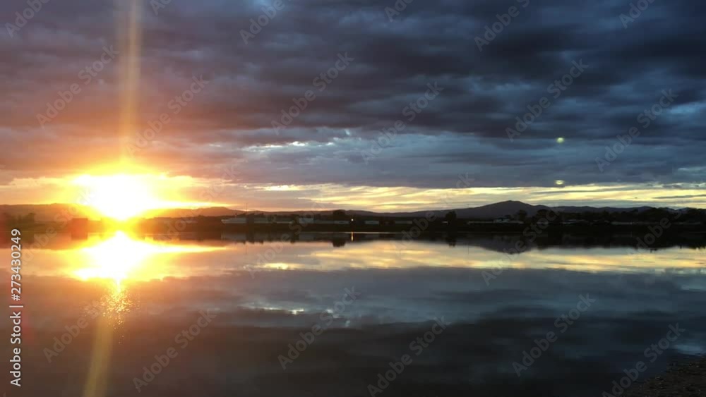 Dramatic Sunset over inlet with Flinders Ranges at the background in Port Augusta, South Australia Dramatic Sunset over inlet with Flinders Ranges at the background in Port Augusta, South Australia