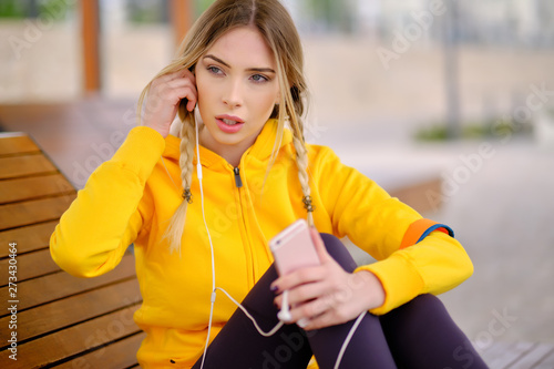 Woman listening music on her headphones