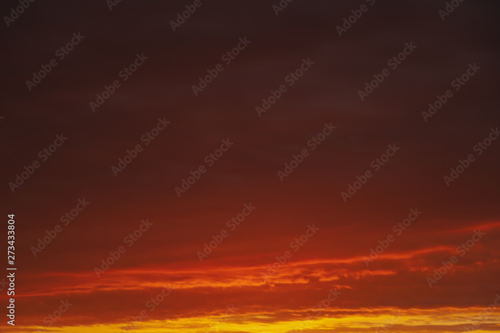 Beautiful bright red orange sunset sky, abstract natural background and texture.
