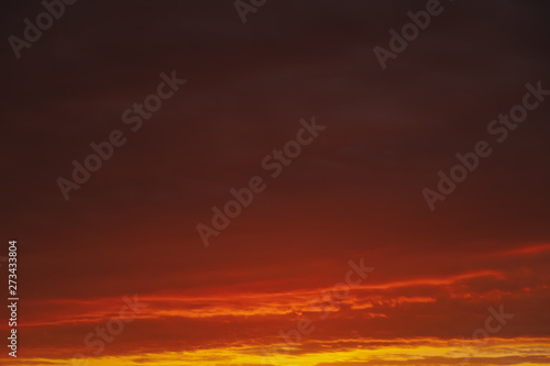 Beautiful bright red orange sunset sky, abstract natural background and texture.