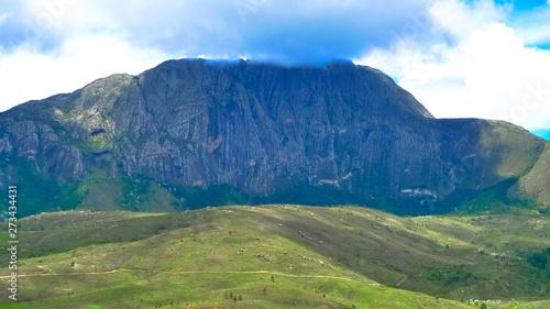 Mount Mulanje  towering over a green landscape photo