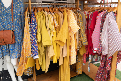 shop clothes for sales at market © OceanProd