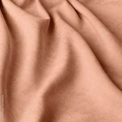 Monochrome decorative fabric velour coral. Fabric with natural texture. Velour textiles. Cloth backdrop