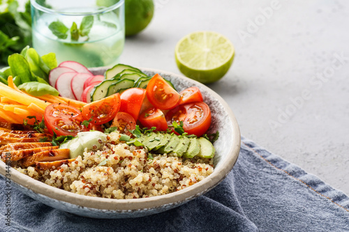 Healthy lunch bowl with chicken, avocado and quinoa.