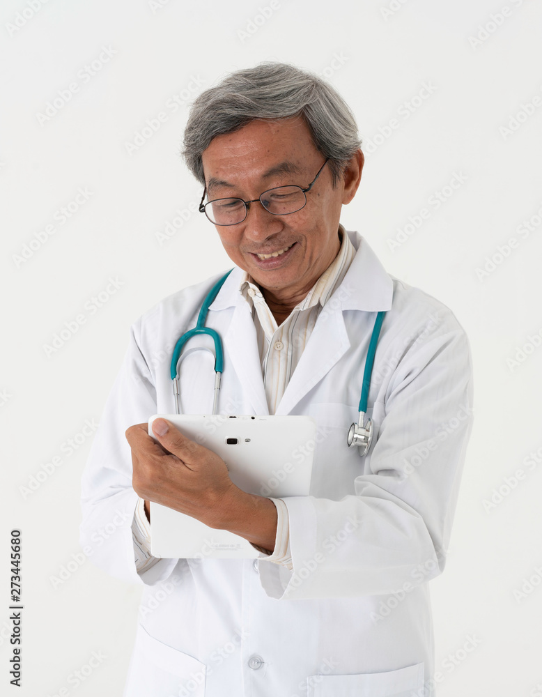 White background portrait of senior asia doctor look and write in tablet 