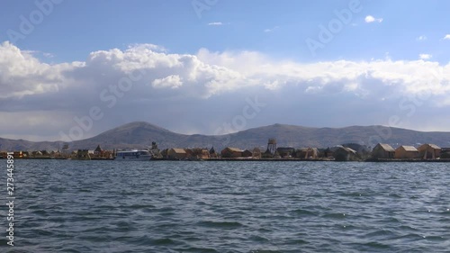 Travelling by ship from Puno to the Uros Islands on Lake Titicaca, Peru, South America photo