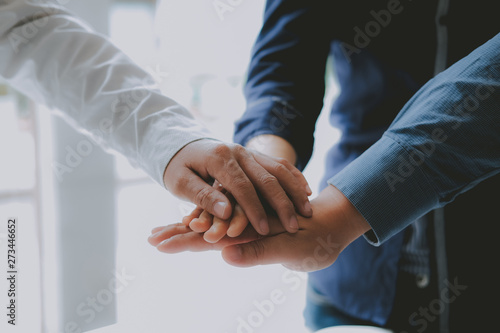 businessman joining united hand, business team touching hands together. unity teamwork partnership concept.