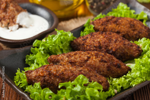 Traditional arabic kibbeh with lamb and pine nuts.