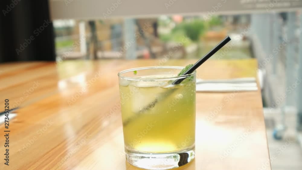 Slow motion zoom in daylight indoor shot of a served soft drink Slow motion zoom in daylight indoor shot of a served soft drink