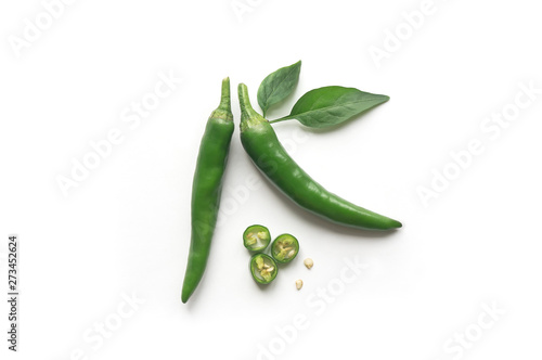 Isolated hot green chili peppers. 