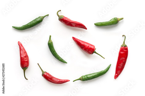 Red and Green hot chilli peppers isolated. Food background. Top view. 
