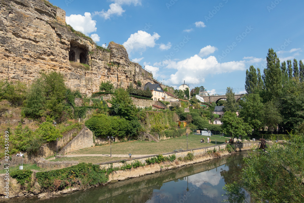 Alzette river Luxembourg city downtown Grund with park and fortifications
