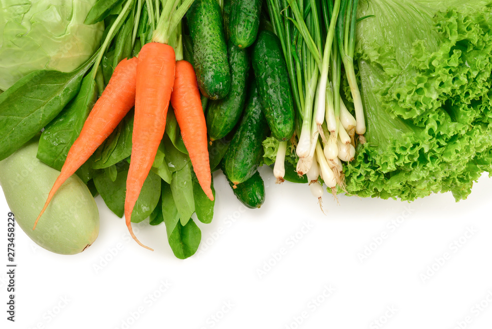 Fresh green vegetables and herbs isolated on white background. Space for text or design.