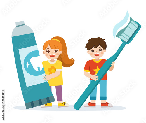 Smiling boy and girl standing, holding toothbrush and toothpaste. showing healthy teeth hygiene and care.