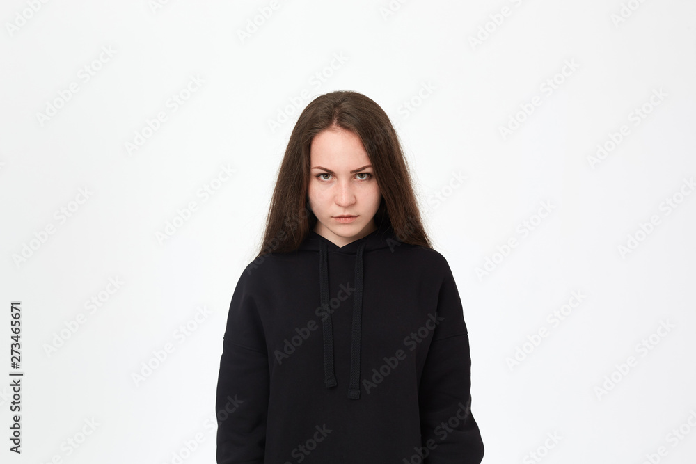 Upset brunette girl isolated on a white background. Upset brunette girl isolated on a white background.