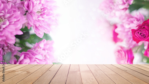 Delicate background of flowers peony. Blurred floral background. Wooden old table on the background of a blooming bouquet