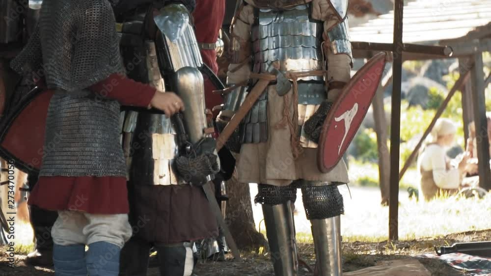 Medieval knights and warriors getting ready for battle Medieval knights and warriors getting ready for battle