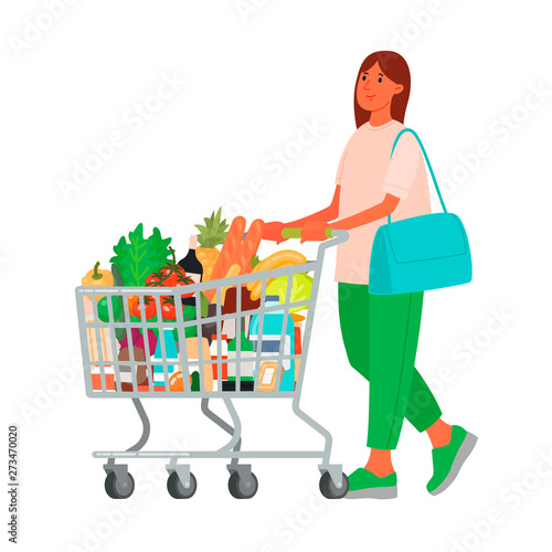 Woman with a grocery cart in the supermarket. Buying food. Customer at a retail grocery store
