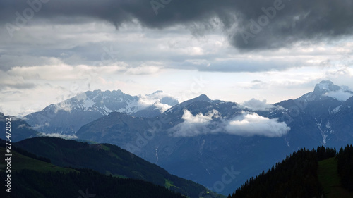 in the mountains with view to the alps on a foggy morning with sunlight © Chamois huntress