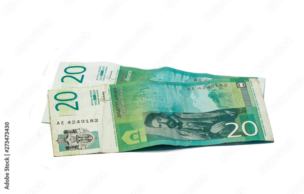 Two banknotes worth 20 Serbian Dinars with a portrait of the ruler of Montenegro Peter II Petrovich isolated on a white background Two banknotes worth 20 Serbian Dinars with a portrait of the ruler of Montenegro Peter II Petrovich isolated on a white background